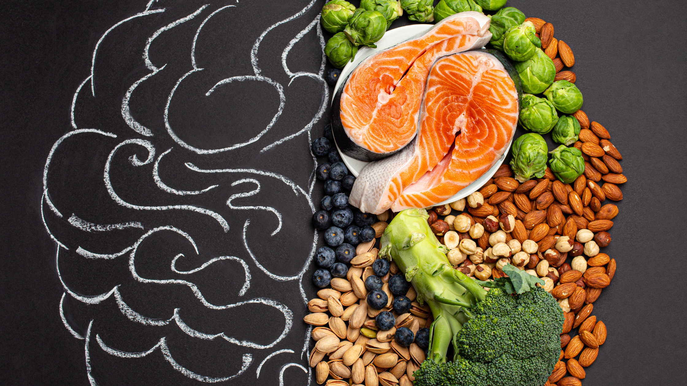 Chalk brain drawing next to healthy foods including salmon, nuts, broccoli, and blueb