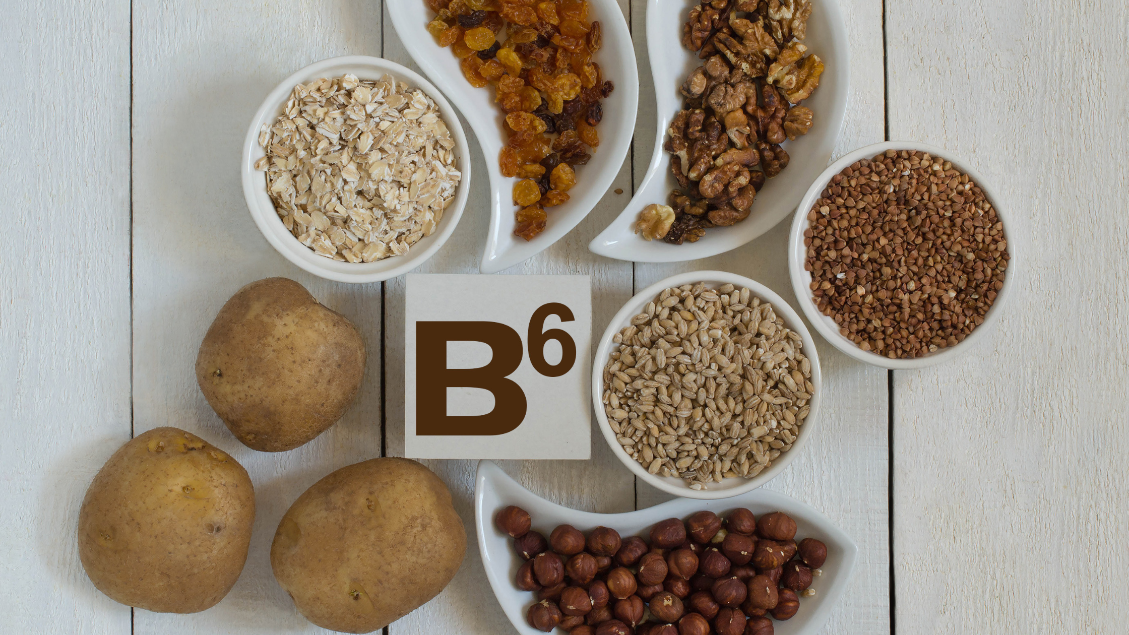 Variety of foods rich in vitamin B6 including potatoes, nuts, grains, and dried fruit