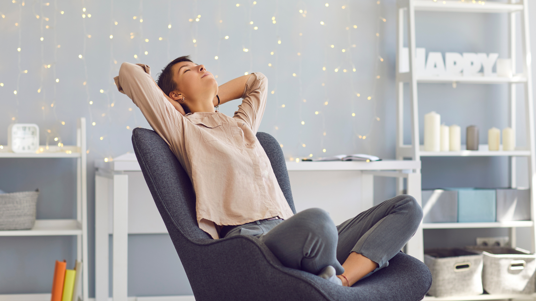 Person relaxing with eyes closed in a modern chair