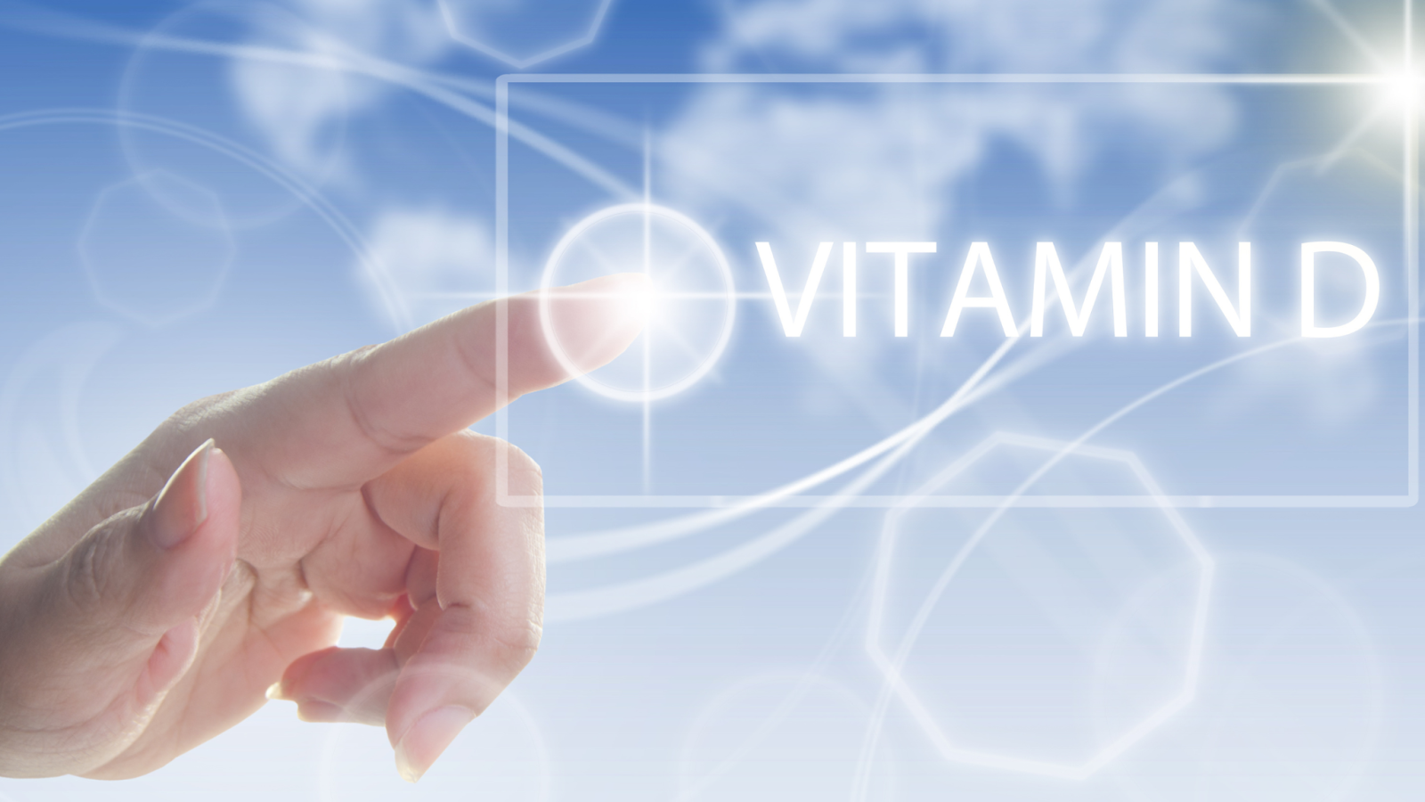 Finger touching glowing Vitamin D text with blue sky background