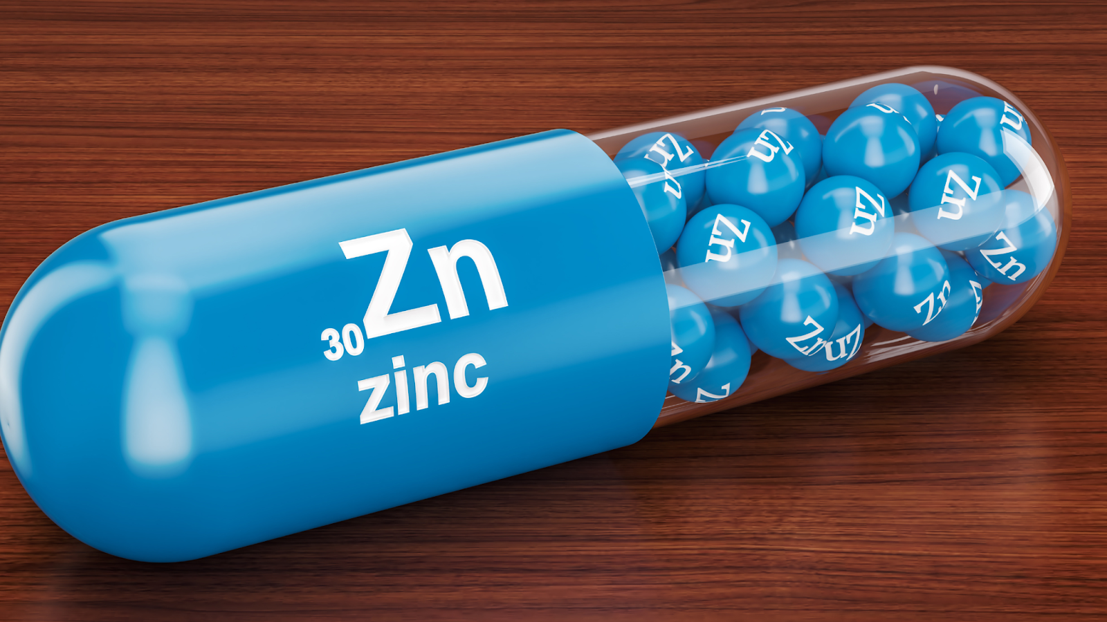Blue capsule with zinc element symbol and small zinc spheres inside