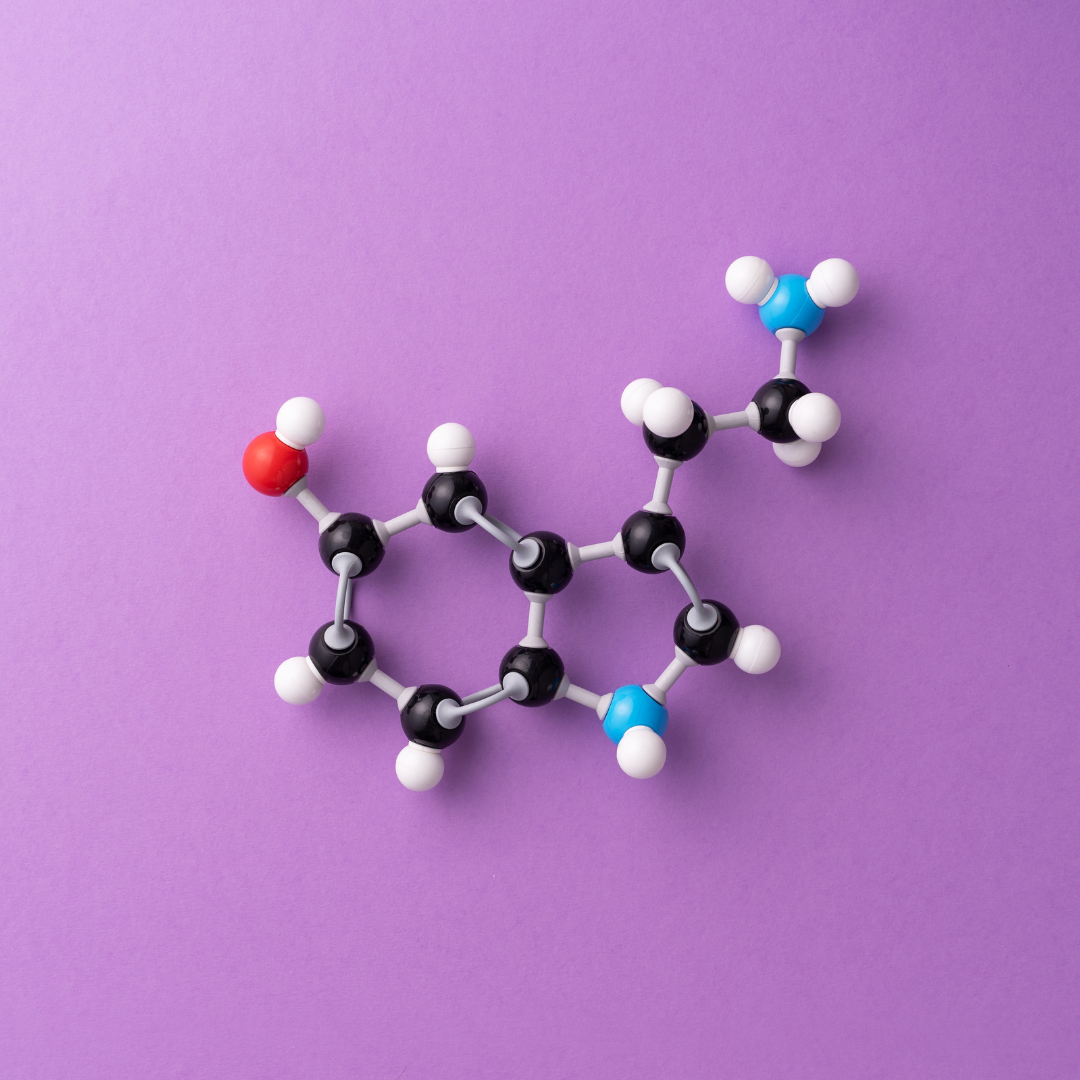Molecular model of a chemical compound on purple background