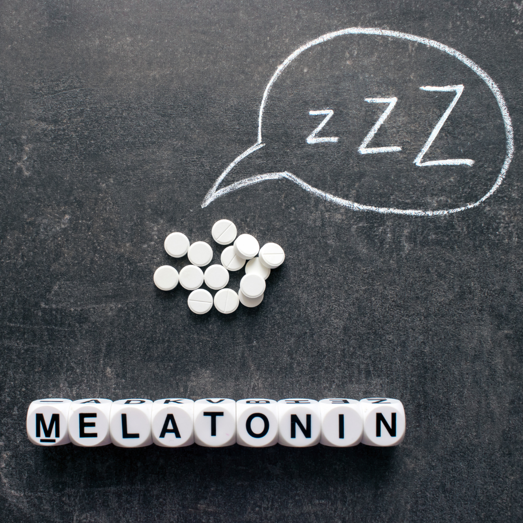Melatonin spelled with letter cubes near white pills and sleep symbol