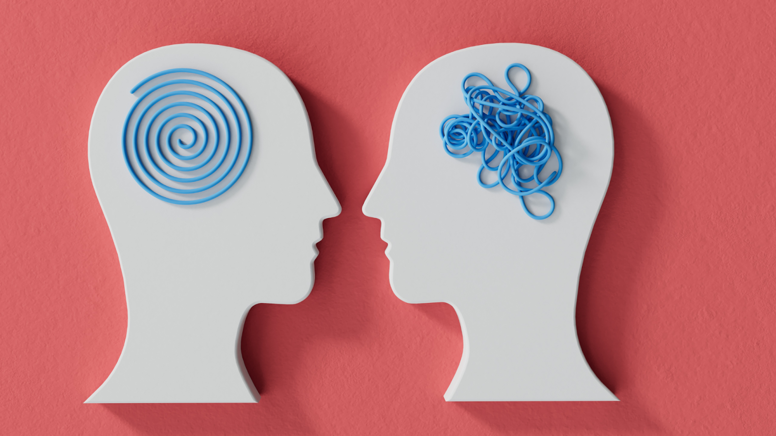 Two white human head profiles with blue spirals and tangled lines inside