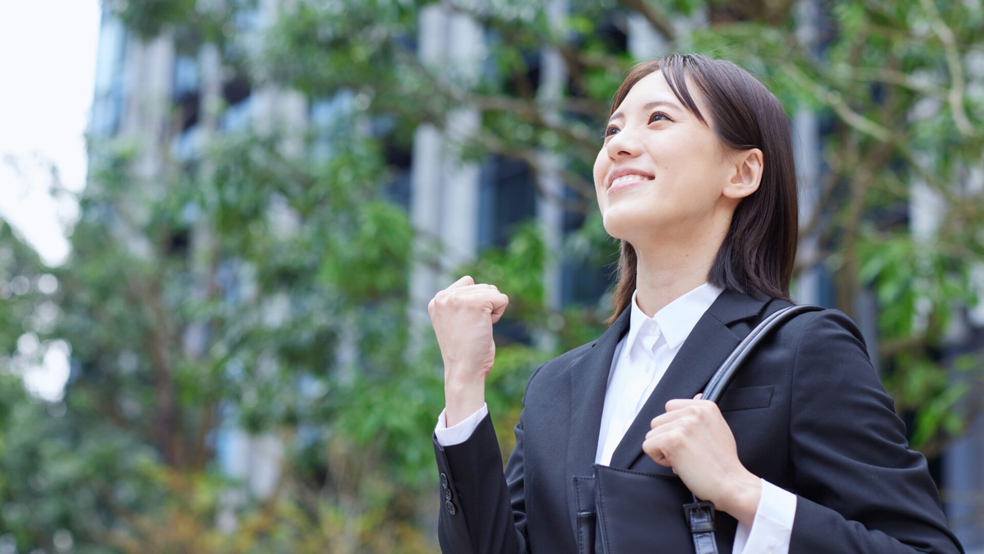 A person stands tall in front of a mirror, smiling confidently, symbolizing steps to build confidence and self-esteem through positive self-reflection.