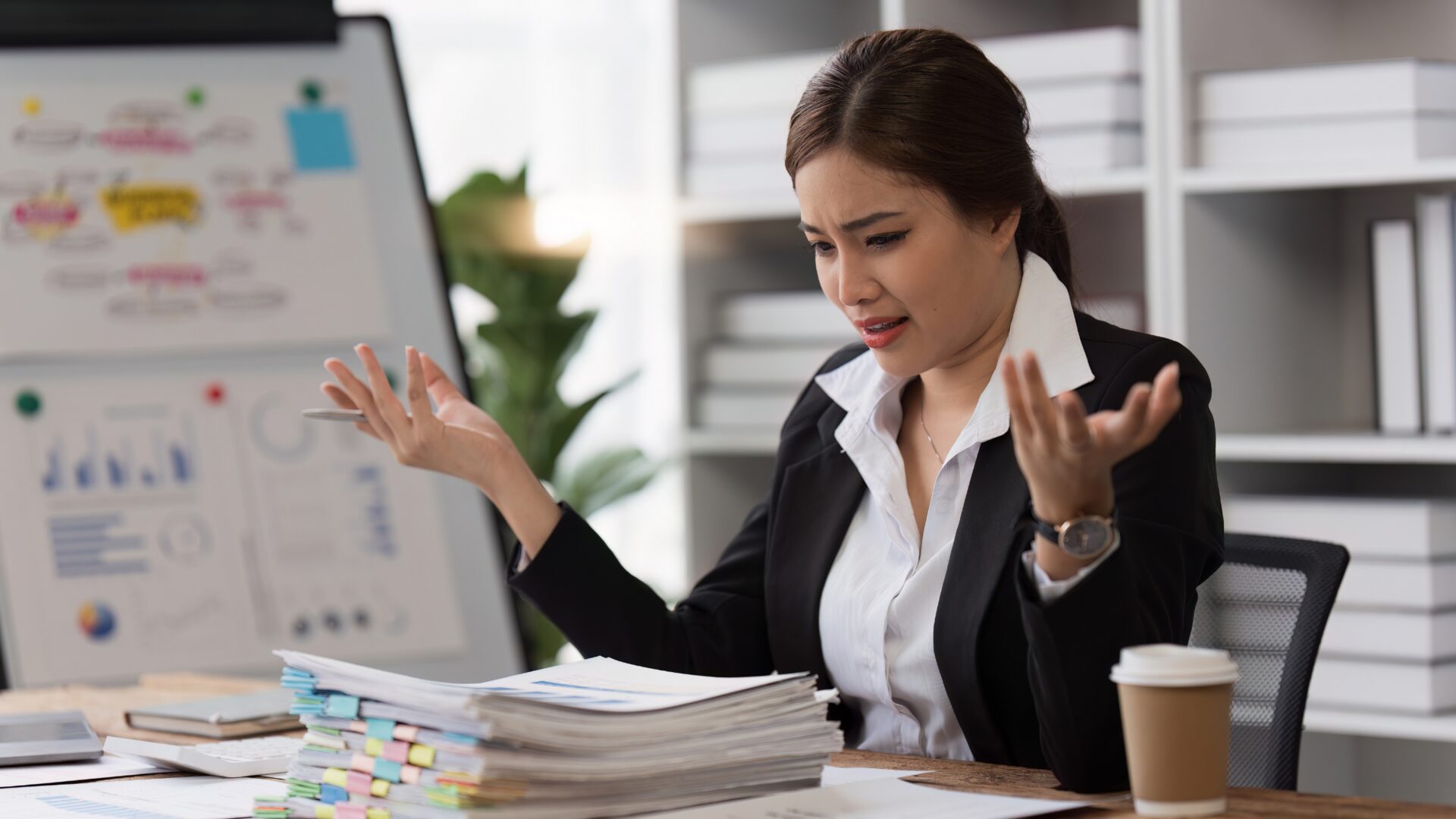 A therapist guides an employee through stress management techniques in a calm office, focusing on therapy for work stress and emotional well-being.