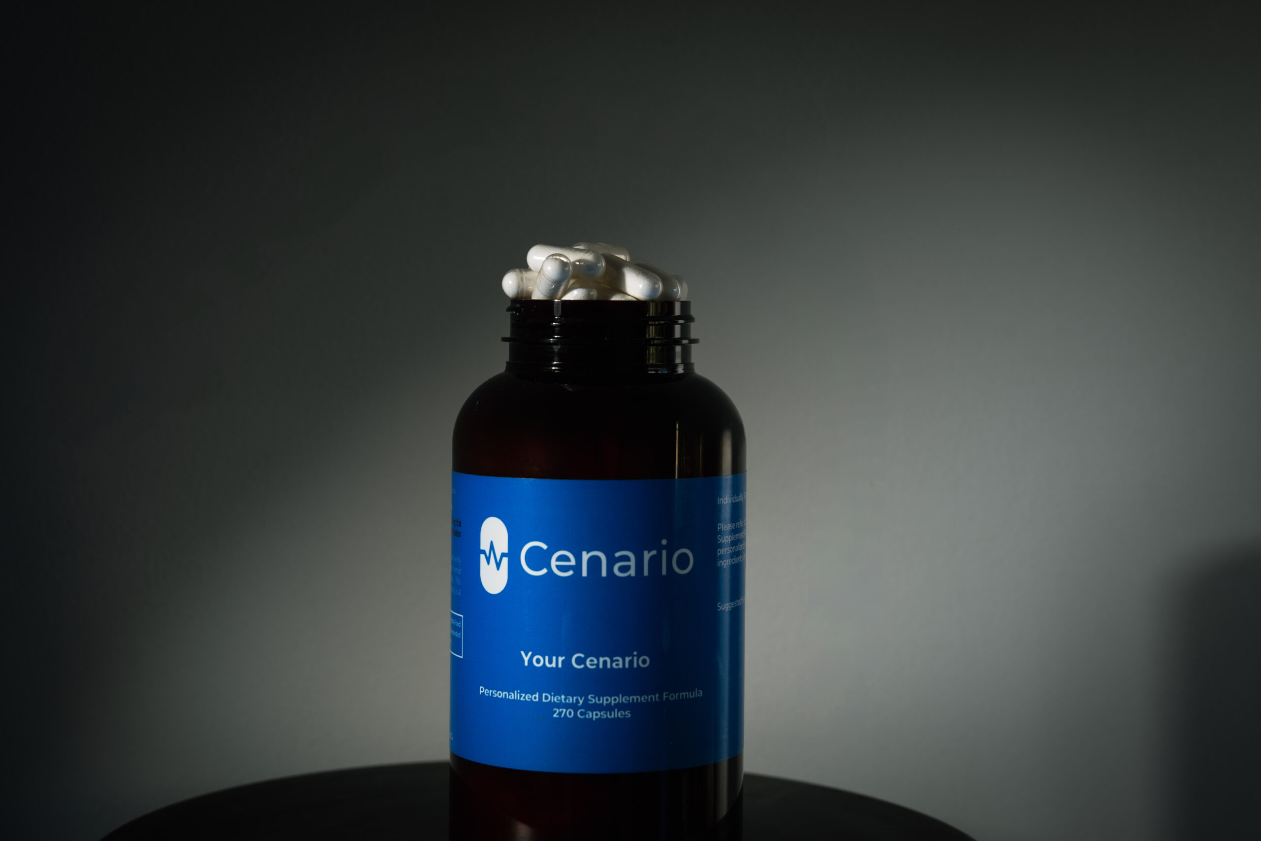 Bottle of Cenario dietary supplement capsules