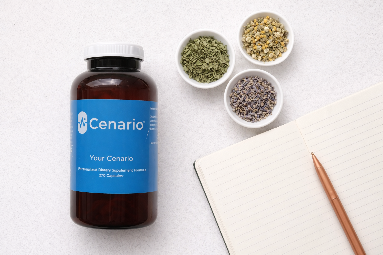 Cenario supplement bottle with herbs in bowls and open notebook with pen