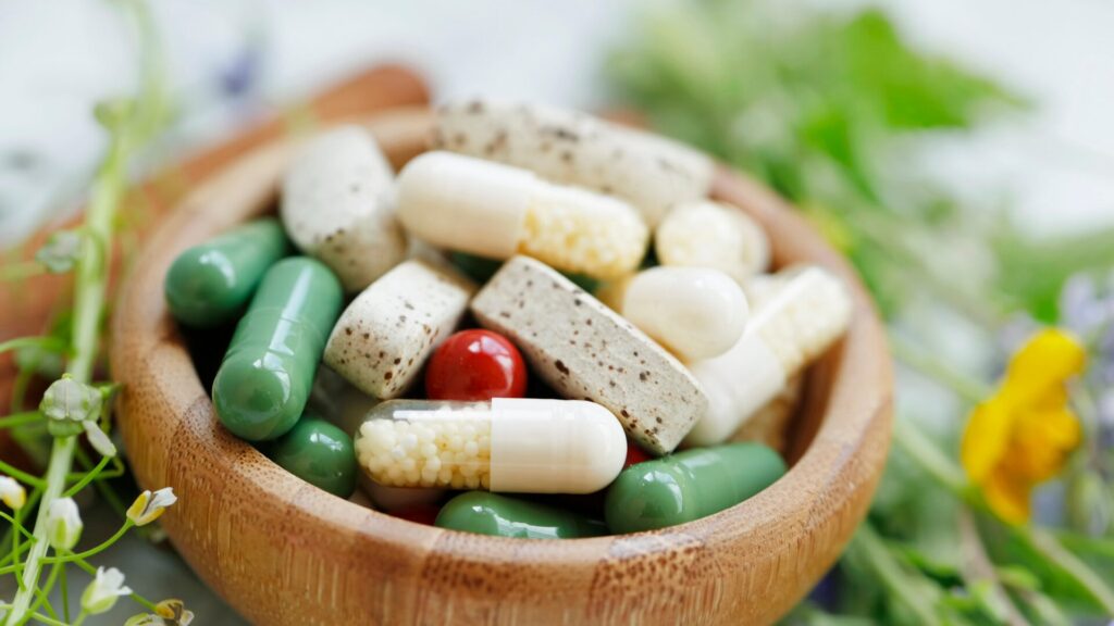 A bottle of non habit forming sleep aid capsules placed on a bedside table, emphasizing safe and natural support for restful sleep without dependency.