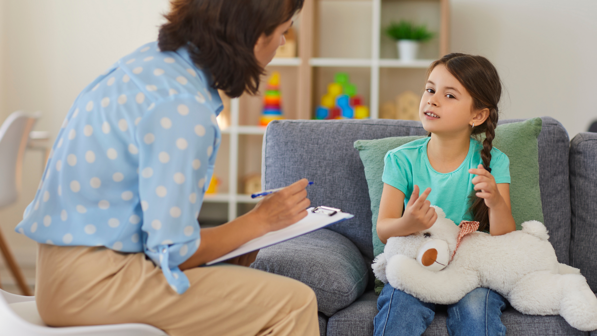 A therapist guides a child with ADHD through behavioral therapy exercises, using visual aids and positive reinforcement techniques in a supportive setting.