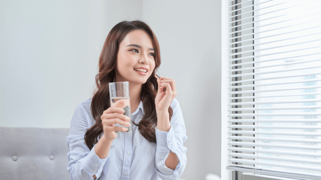 Bottles of essential vitamins for adults, including multivitamins, vitamin D, and B-complex, arranged on a table to support overall health and wellness.