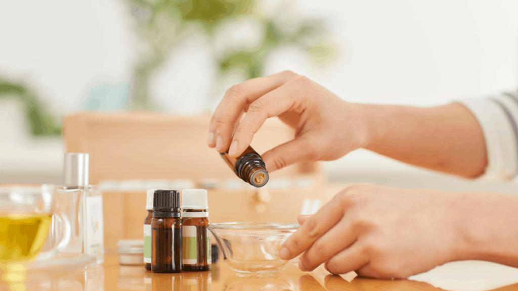A selection of essential oil blends for sleep, including lavender, chamomile, and cedarwood, arranged in glass bottles on a bedside table for relaxation.