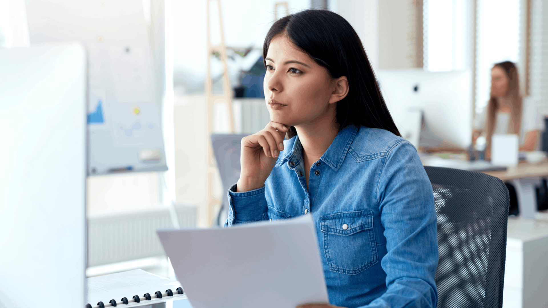 A person performing focus exercises at a desk, practicing deep breathing and concentration techniques to improve mental clarity and attention span.