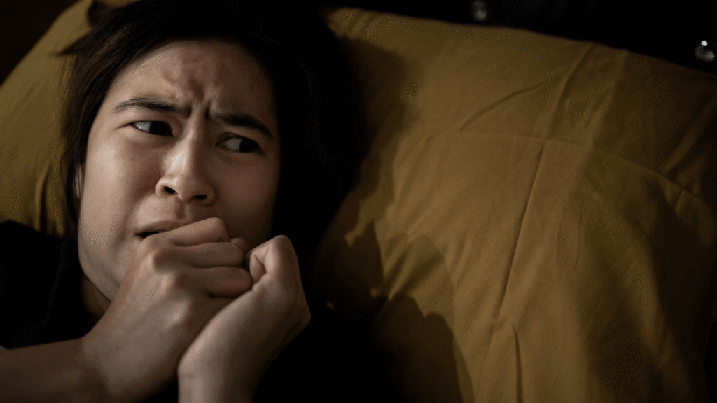 A person perceives vivid images or sounds that are not present, illustrating the experience of hallucination as a sensory perception without external stimulus.