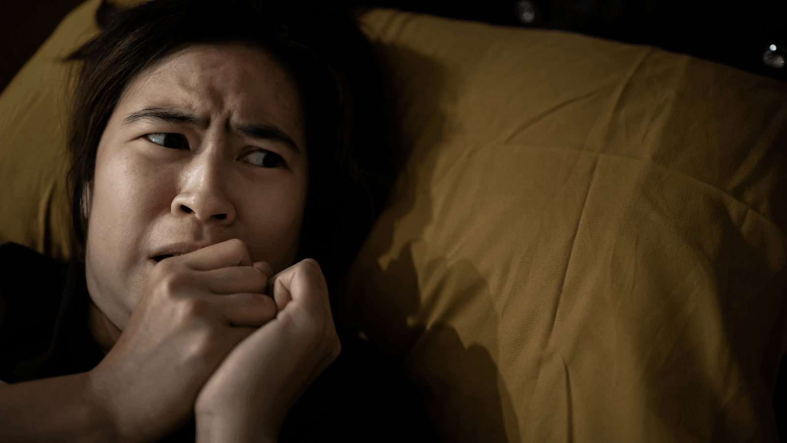 A person perceives vivid images or sounds that are not present, illustrating the experience of hallucination as a sensory perception without external stimulus.