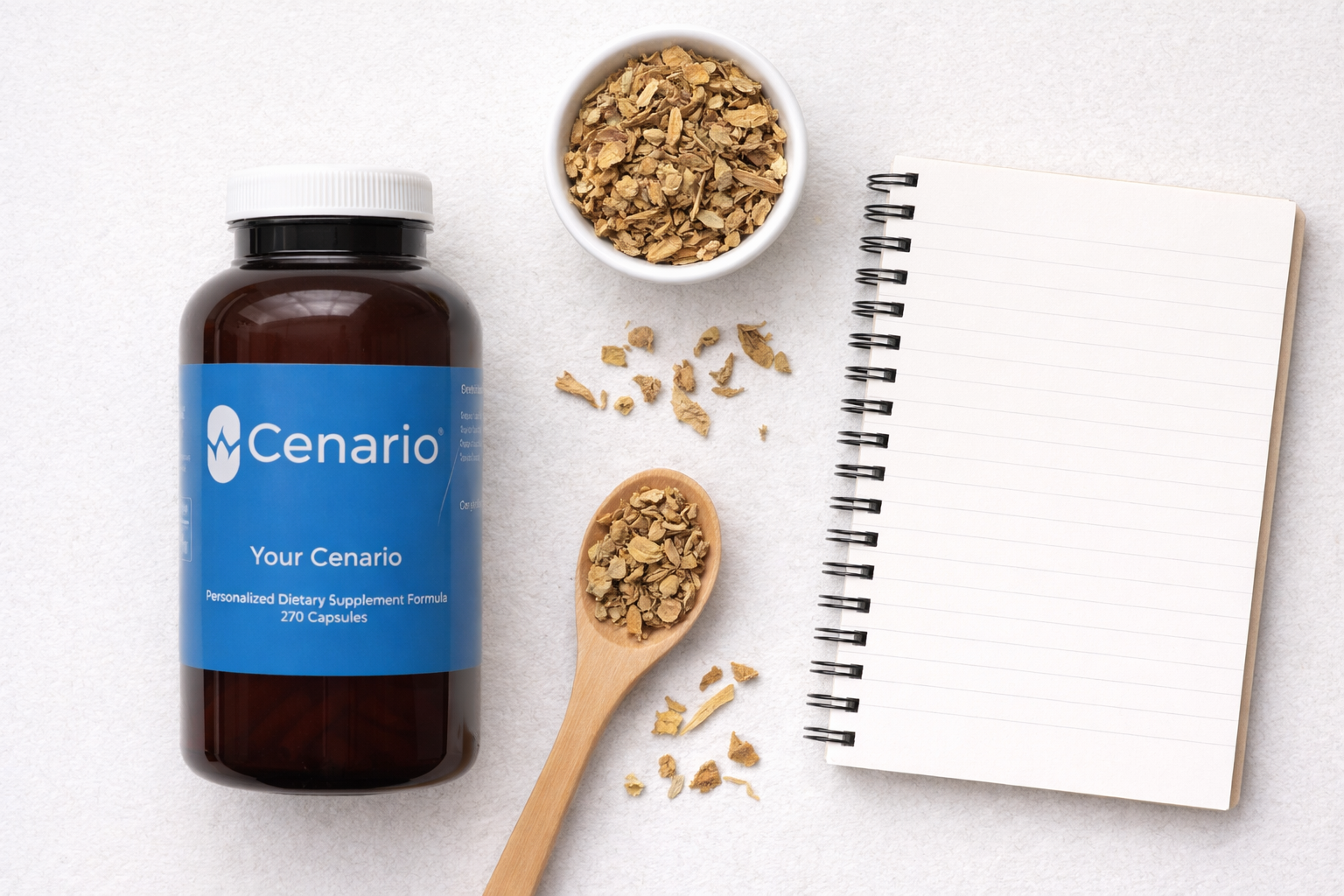 Supplement bottle labeled Cenario with herbs and blank notebook