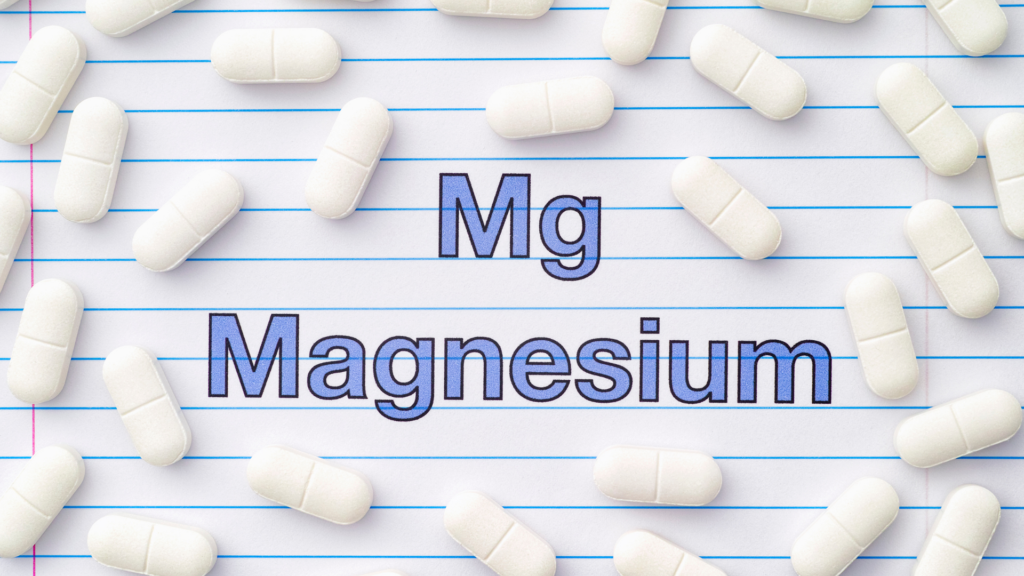 Bottles of magnesium supplements labeled for anxiety relief, including magnesium glycinate and magnesium citrate, displayed on a table with calming decor.