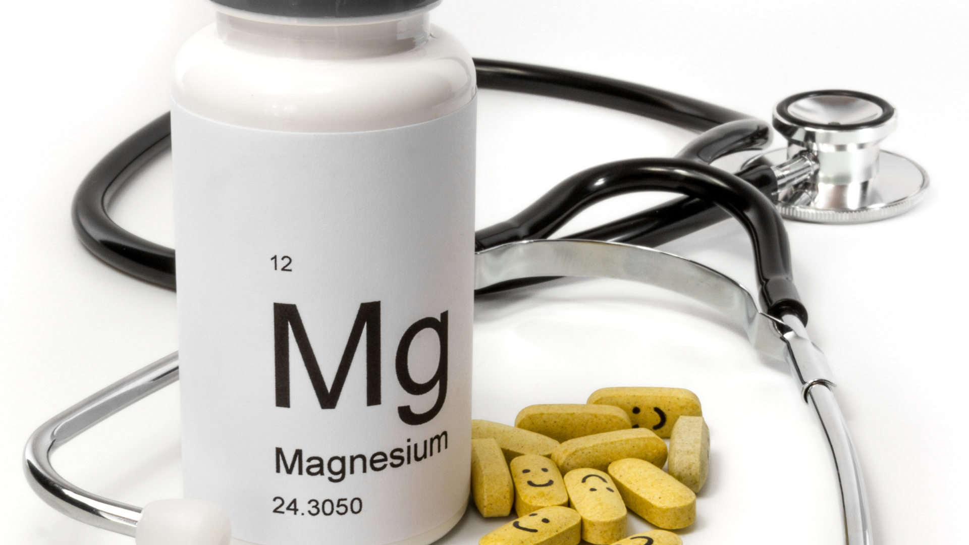 A person taking a magnesium supplement in the evening to help manage anxiety symptoms and promote relaxation before bedtime.