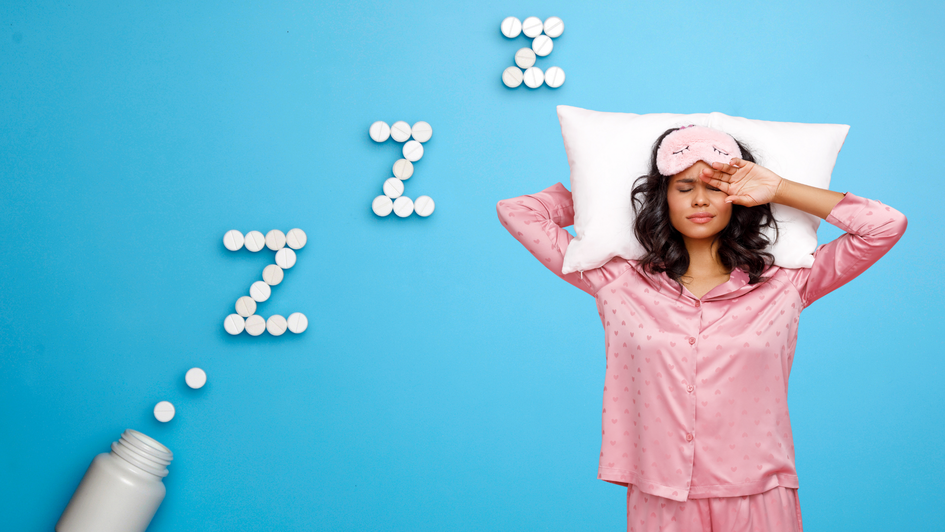 A variety of over the counter sleep aid medications and supplements, including melatonin tablets and diphenhydramine capsules, displayed on a pharmacy shelf.