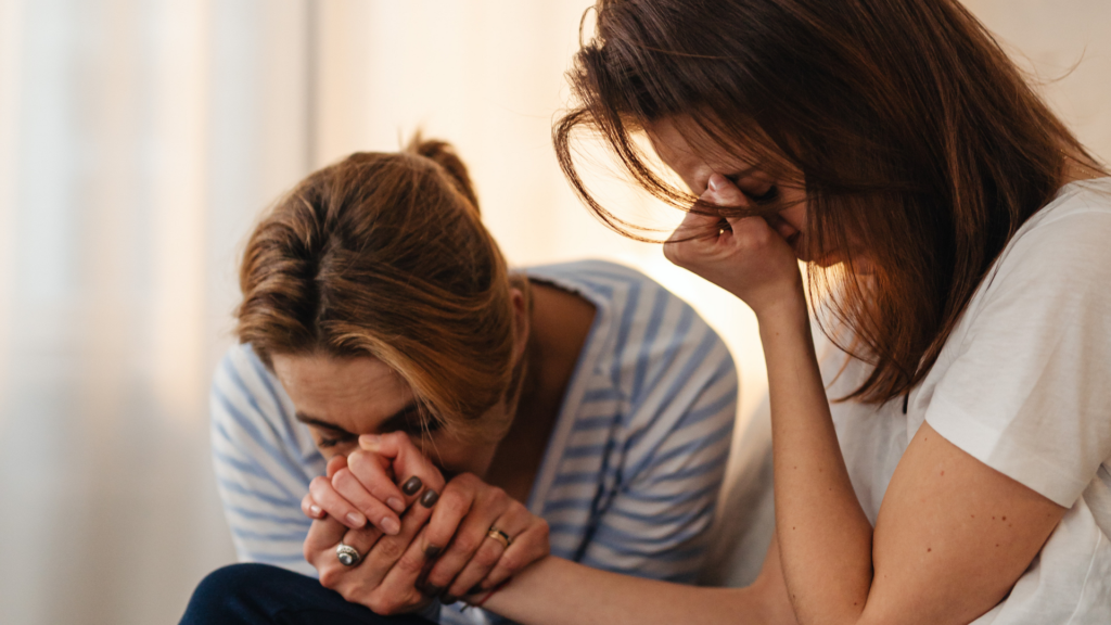 A group of suicide attempt survivors sit in a support circle, sharing experiences and offering mutual encouragement in a safe, compassionate environment.