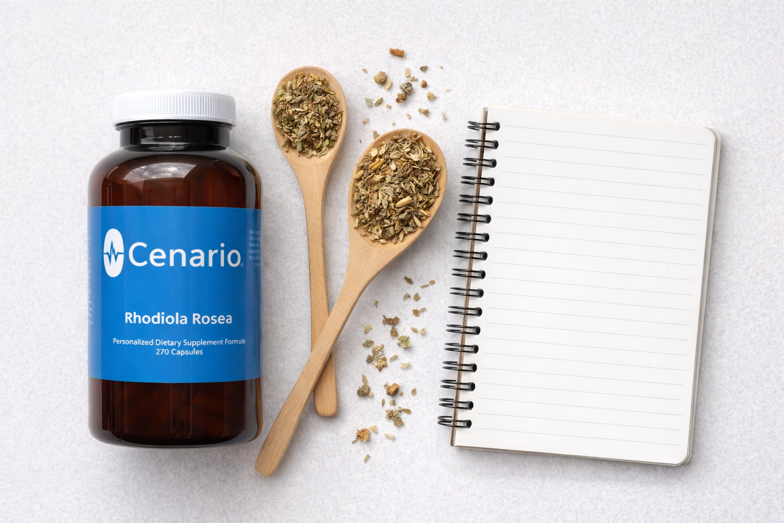 Cenario Rhodiola Rosea supplement bottle with wooden spoons of herbs and blank notebo