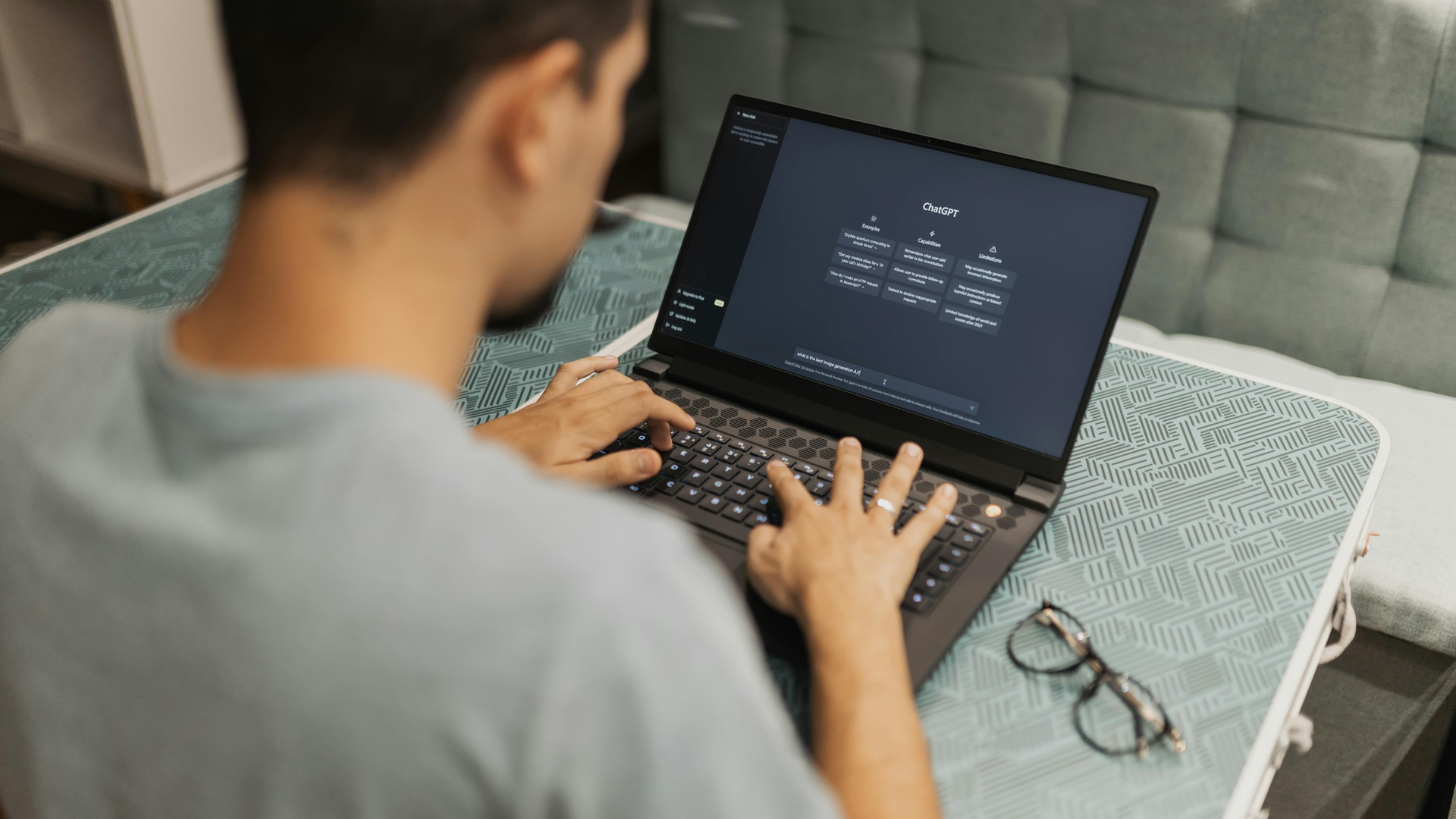 A therapist and client sit across from each other in a calm, softly lit room, engaging in a supportive conversation during a therapy session.