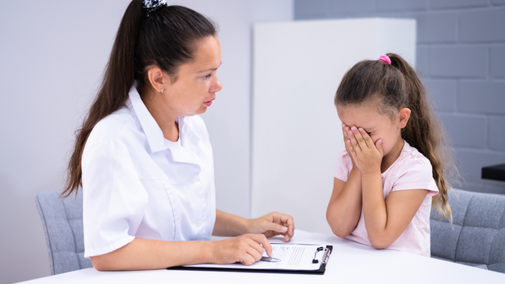 A therapist uses trauma-focused cognitive behavioral therapy techniques to help a child process and heal from childhood trauma in a supportive environment.