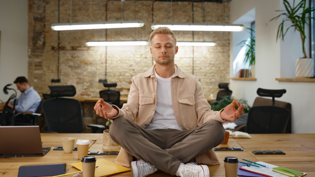 Employees participating in corporate wellness challenges, engaging in group fitness activities and tracking progress on digital devices in a modern office setting.
