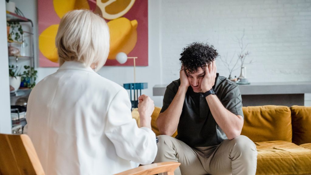 A person sits calmly with closed eyes, practicing mindfulness meditation as a therapy technique to relieve emotional burnout and restore mental balance.