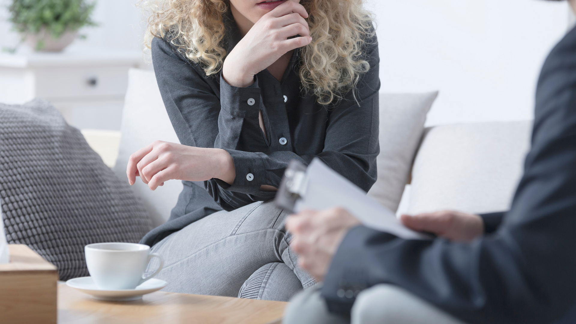 A therapist guides a client through cognitive behavioral therapy techniques to overcome fear of failure and build confidence in personal and professional goals.