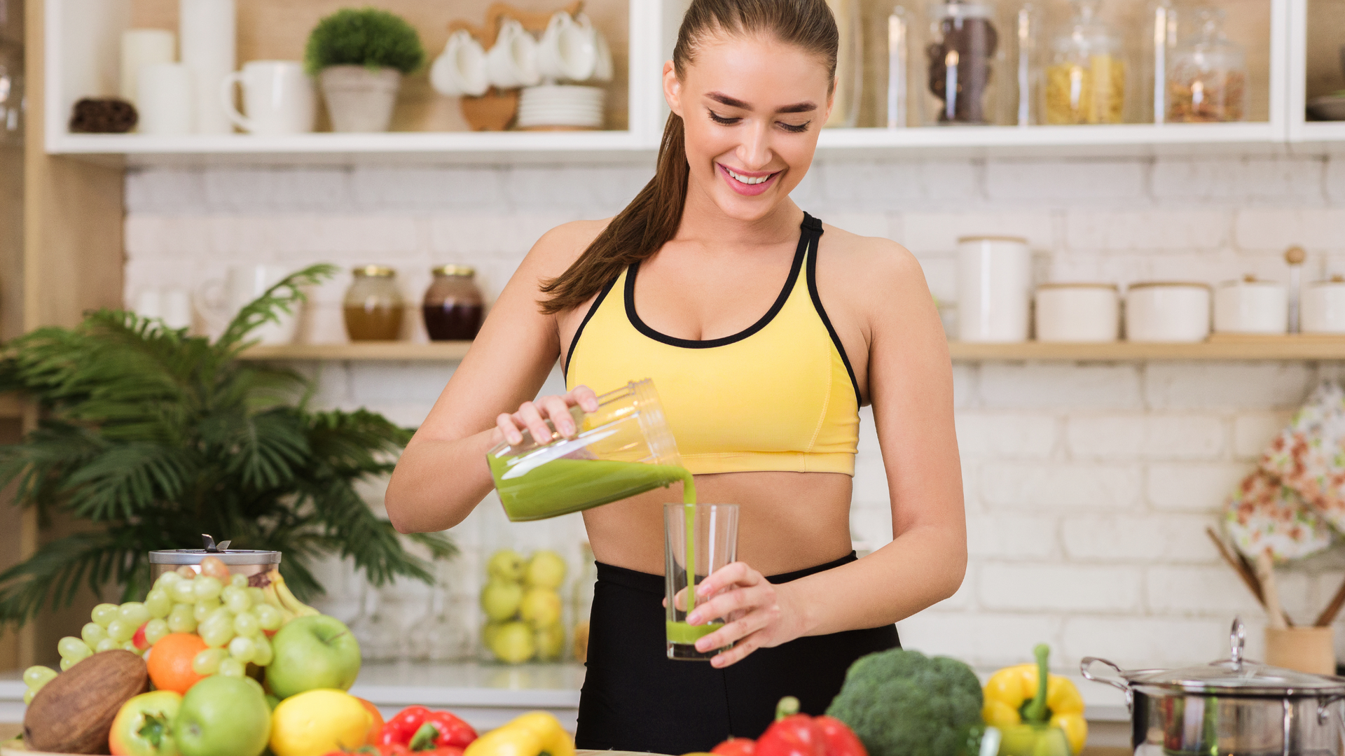A selection of fresh fruits, vegetables, and herbal teas arranged on a wooden table, representing natural ingredients commonly used for detox diets.