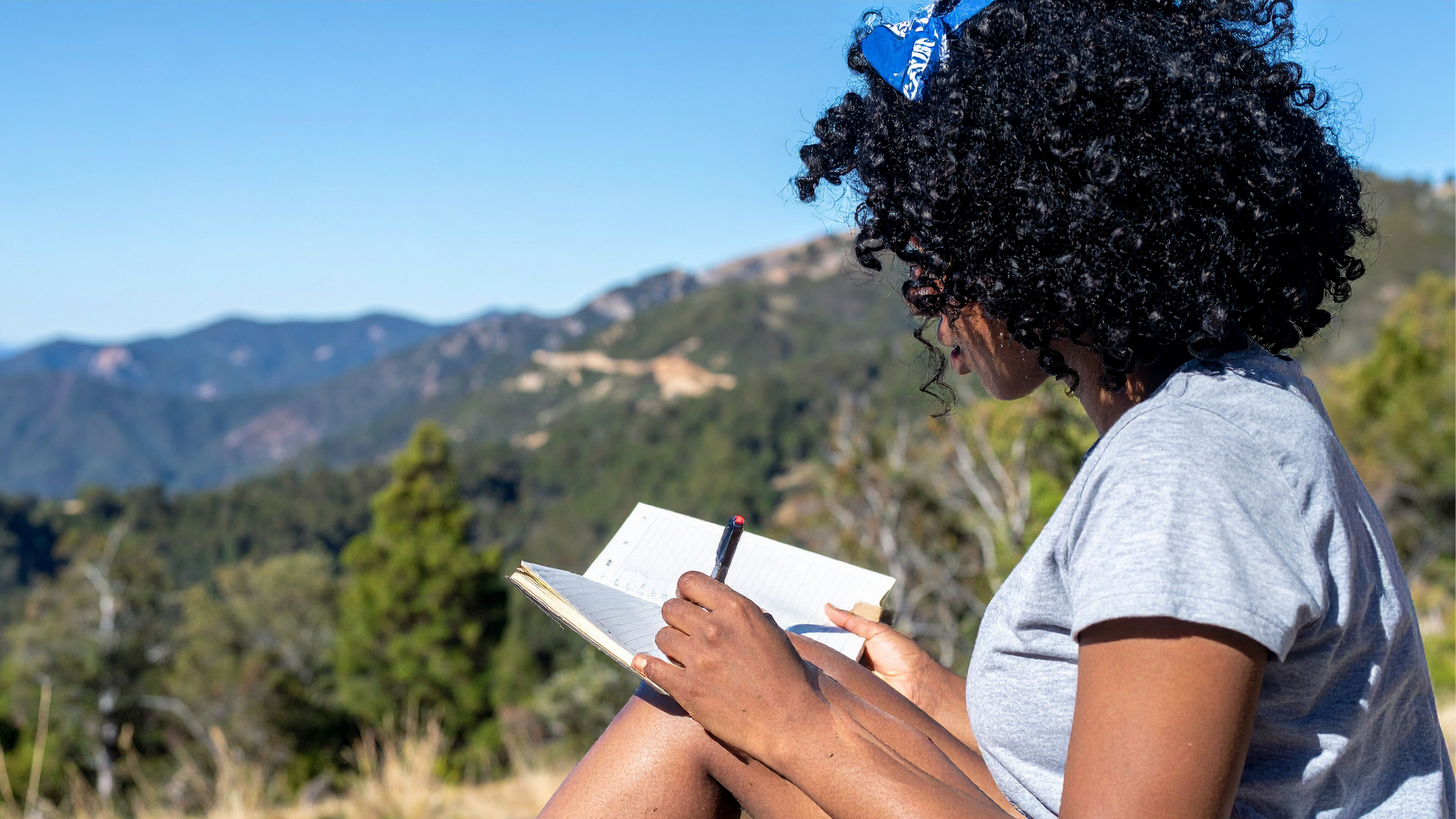 Open journal with handwritten notes, a pen resting on the page, and a cup of coffee nearby, illustrating a peaceful journaling session.