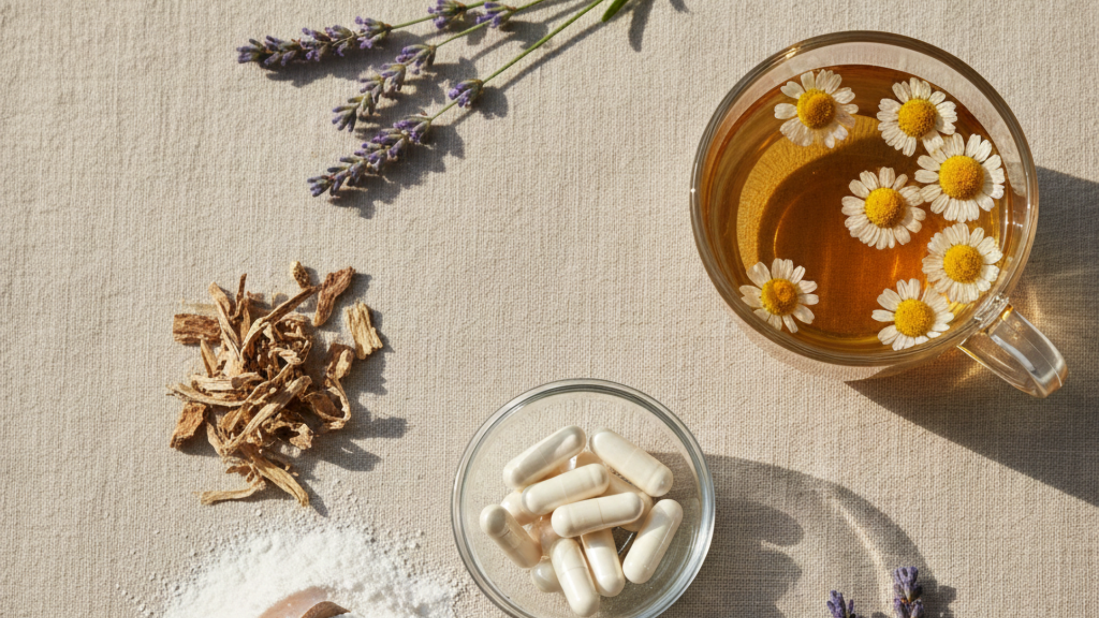 Herbal tea with chamomile flowers, capsules, and dried herbs